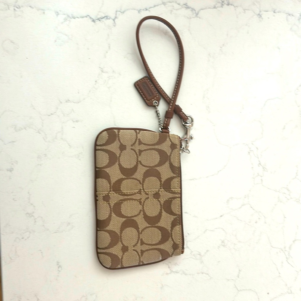 Coach wristlet. Brown. Used 1x and in excellent condition!